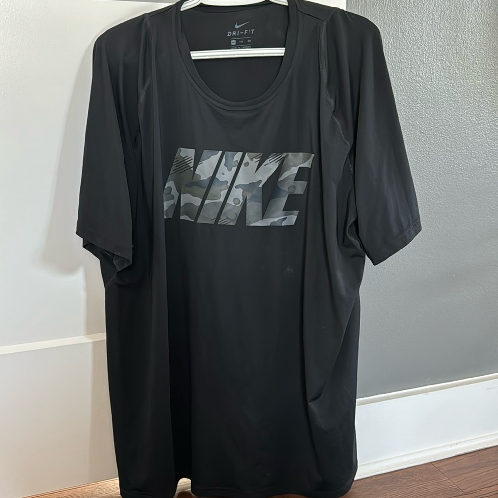 NIKE. Men’s, DRI FIT, black w/ camouflage logo t shirt.